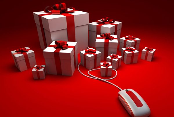 presents on red background with computer mouse holiday presents